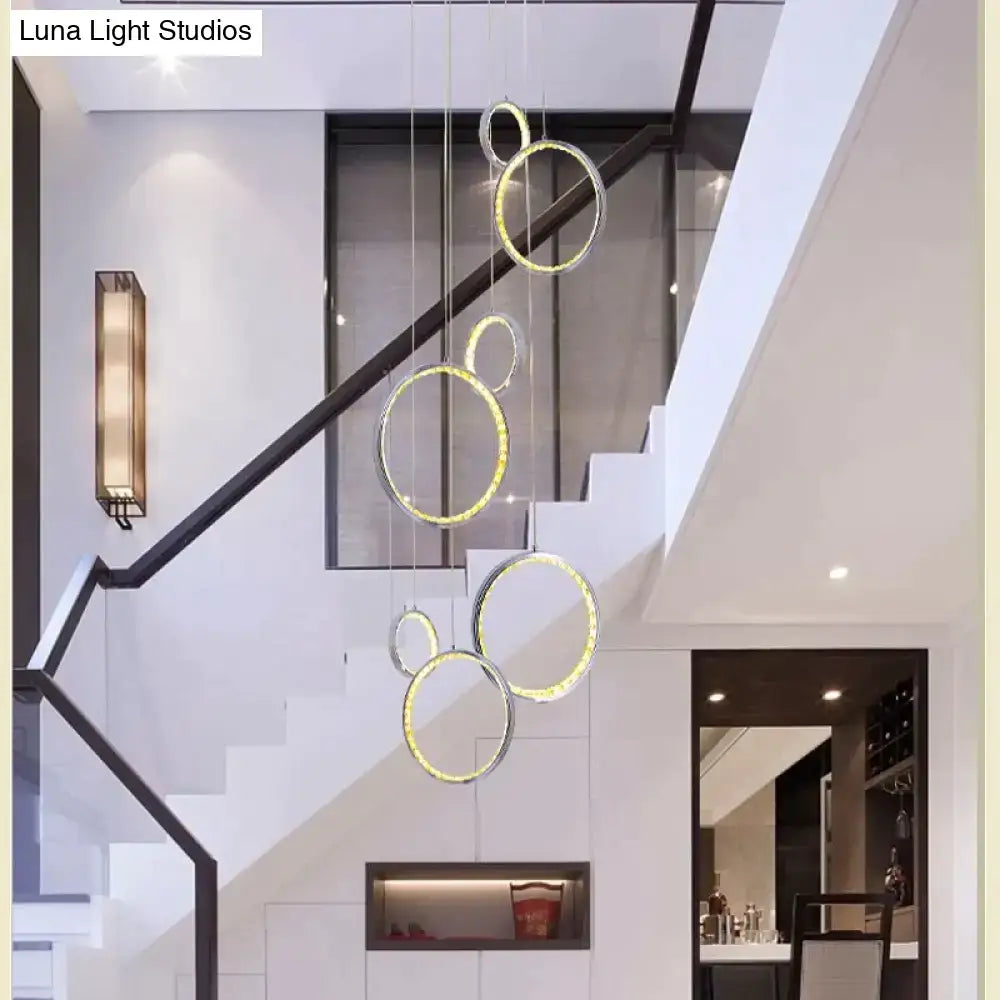 Modern DecorBites™ circle led crystal pendant lamp with interlocking rings and warm golden illumination for living rooms