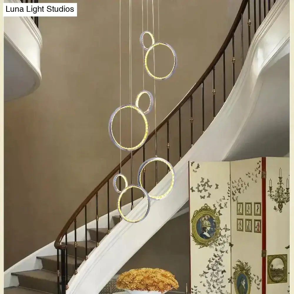 Modern decorbites circle led crystal pendant lamp with glowing rings suspended by thin cords for dining room lighting