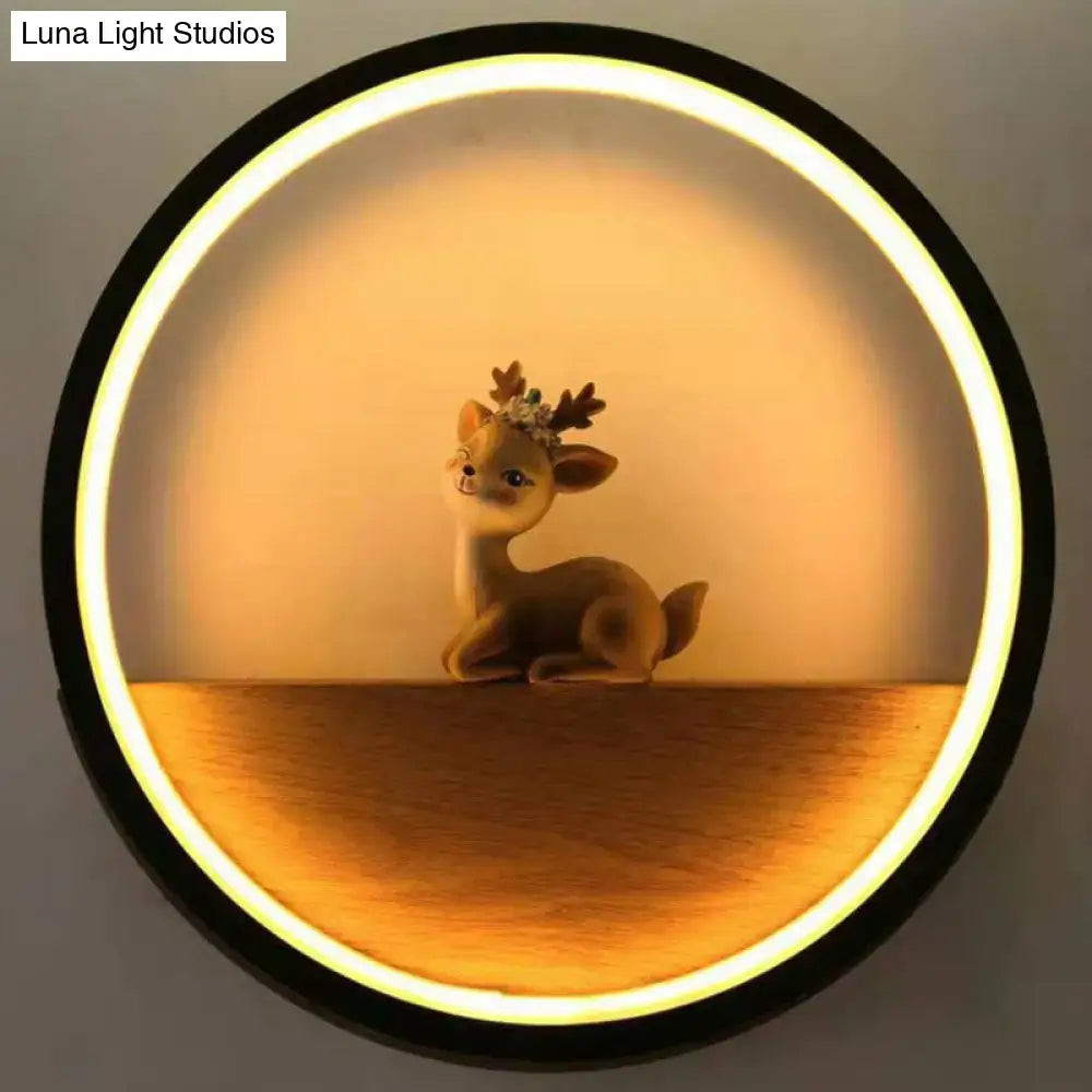 A charming brown ceramic decorative deer with floral crown illuminated by modern circular black wall light