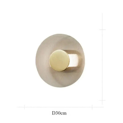 Modern circular brushed metallic wall lamp with concentric ridged texture for elegant glass wall decorbites elegant glass wall use