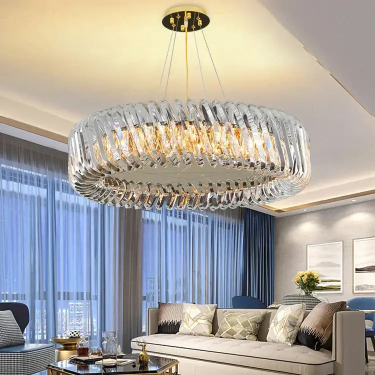 A modern circular crystal led ceiling chandelier with clear rings and gold-toned accents for dining room decorbites crystal led