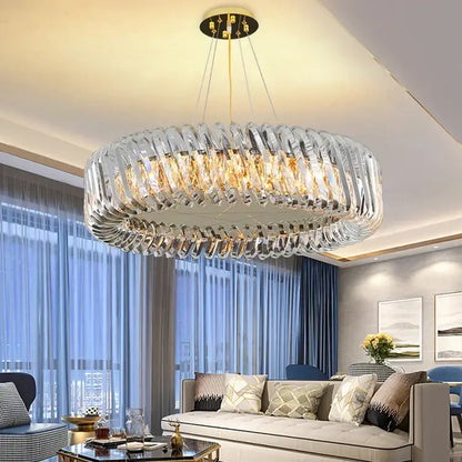 A modern circular crystal led ceiling chandelier with clear rings and gold-toned accents for dining room decorbites crystal led