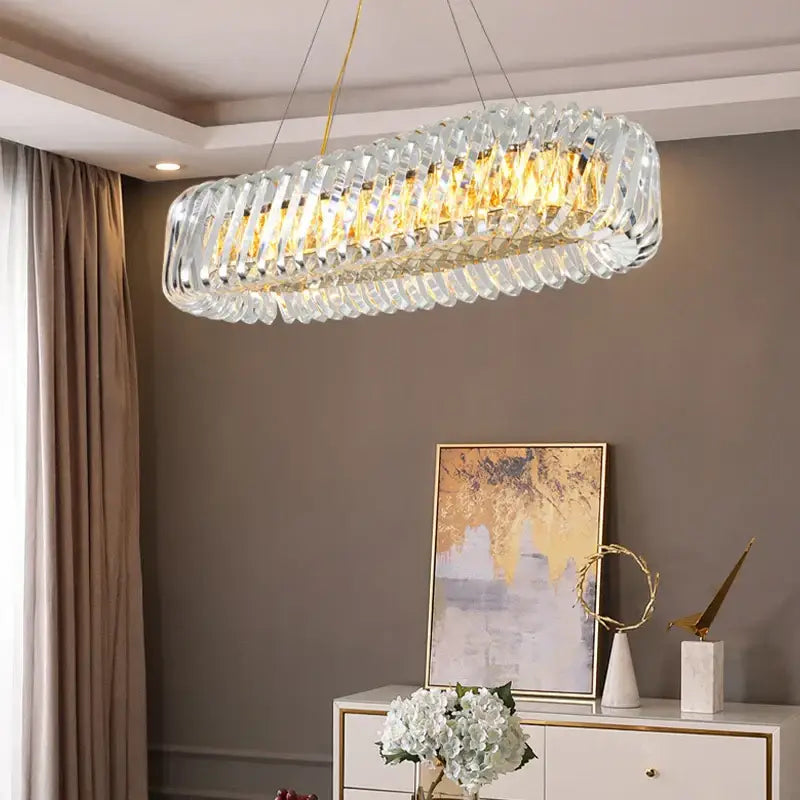 Modern circular crystal led ceiling chandelier with gold-toned frame and hanging wires for dining room decorbites crystal led