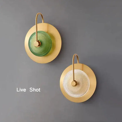 Modern circular green copper wall lamp with two brass sconces featuring green and clear textured glass discs decorbites circular green
