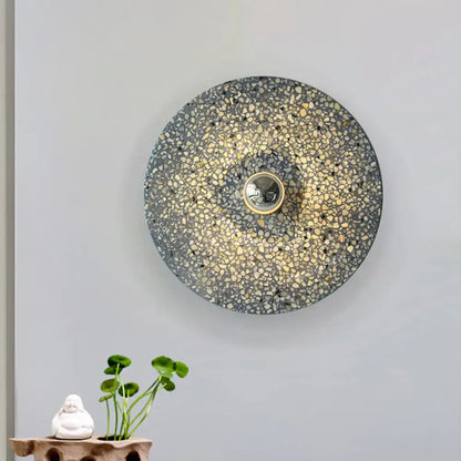 Modern circular terrazzo wall light in beige lake blue with speckled gray and gold mosaic finish for corridors