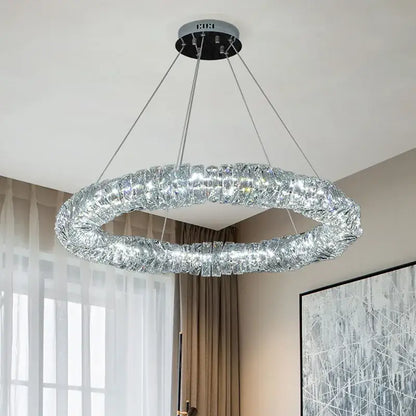 Modern circular textured crystal chandelier pendant light with shimmering silver frame and decorbites dimmable crystal elements