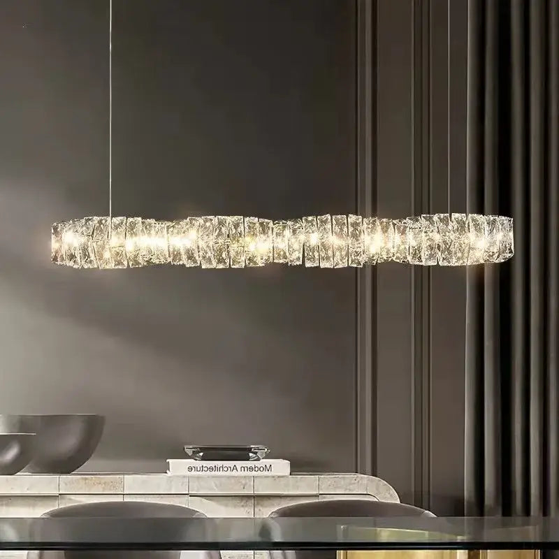 Modern circular textured crystal chandelier pendant light with elongated segmented design and warm glowing decorbites dimmable crystal