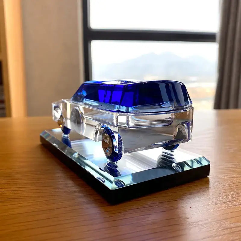 Modern clear and blue crystal car figurine with vibrant blue roof and wheels on mirrored base for living room decorbites crystal car