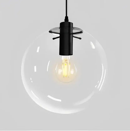 Modern clear bubble glass ball pendant light with a black metal fixture and exposed filament bulb for kitchen decorbites