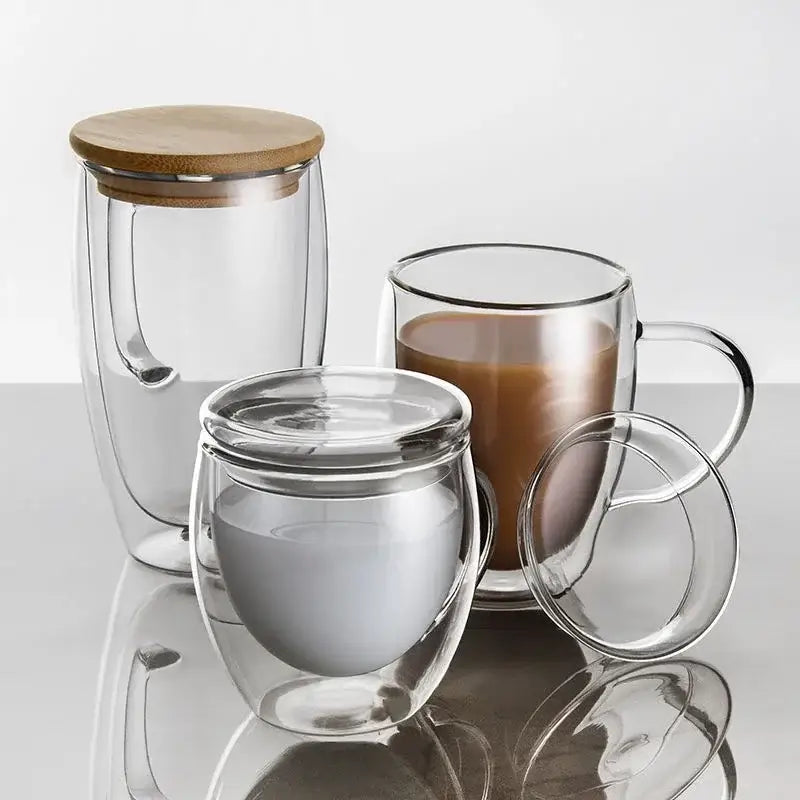 Modern clear double wall tumbler set featuring glass mugs with handles and bamboo lids for dining room use
