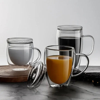 Modern clear double wall tumbler set with bamboo lids featuring clear glass mugs filled with milk and orange juice