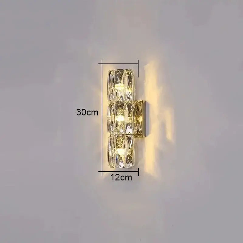 Modern clear faceted crystal wall lamp with three stacked elements and gold-toned base for luxury living room decorbites crystal high-end