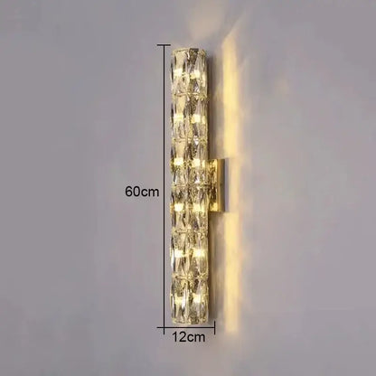 Modern wall lamp with clear faceted crystal segments in a gold metal frame by decorbites crystal high-end design