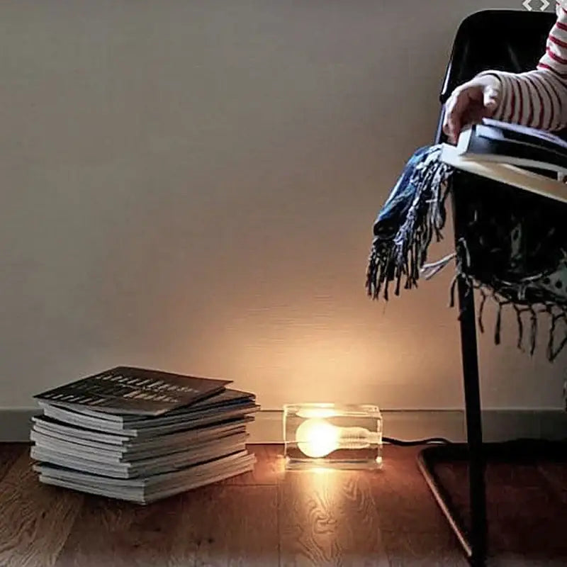 Modern clear glass cube led table lamp with glowing incandescent bulb for bedroom nightlight use