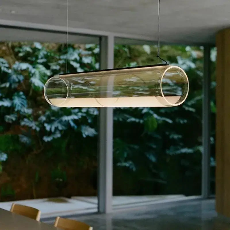 Modern clear glass cylinder pendant light with sleek design ideal for dining room decorbites clear glass fixture