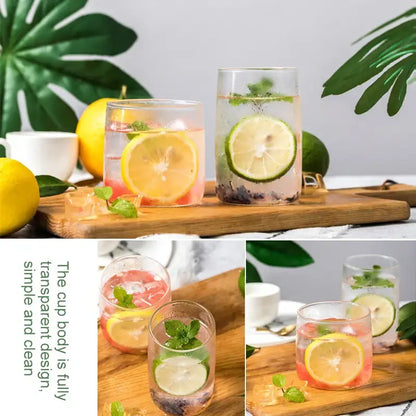 Modern clear glass drinkware cup set featuring transparent tumblers with colorful citrus beverages and fresh mint garnish