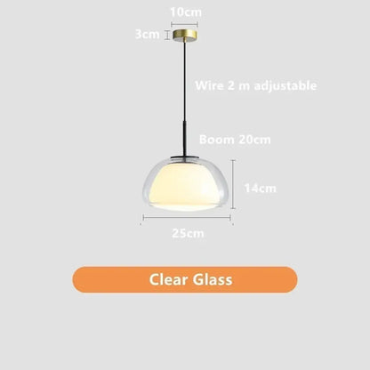 Modern clear glass jelly pendant lamp with brass-finished top and black wire suspension for living room lighting