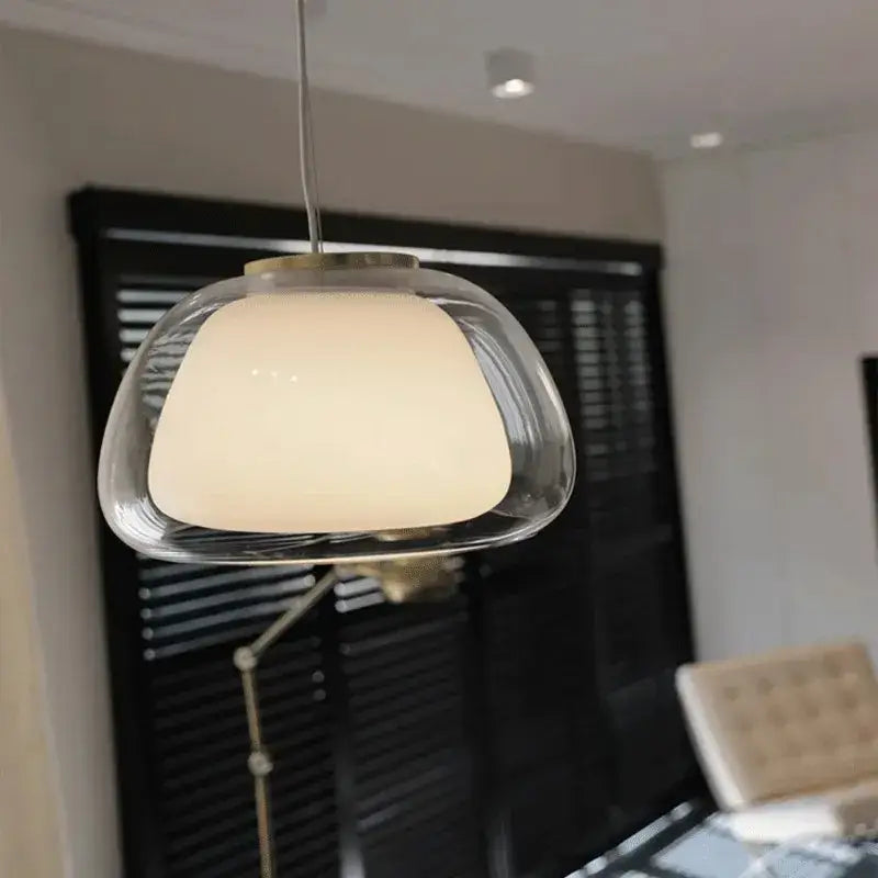 Modern clear glass jelly pendant lamp with frosted inner shade and metallic chain for living and dining rooms