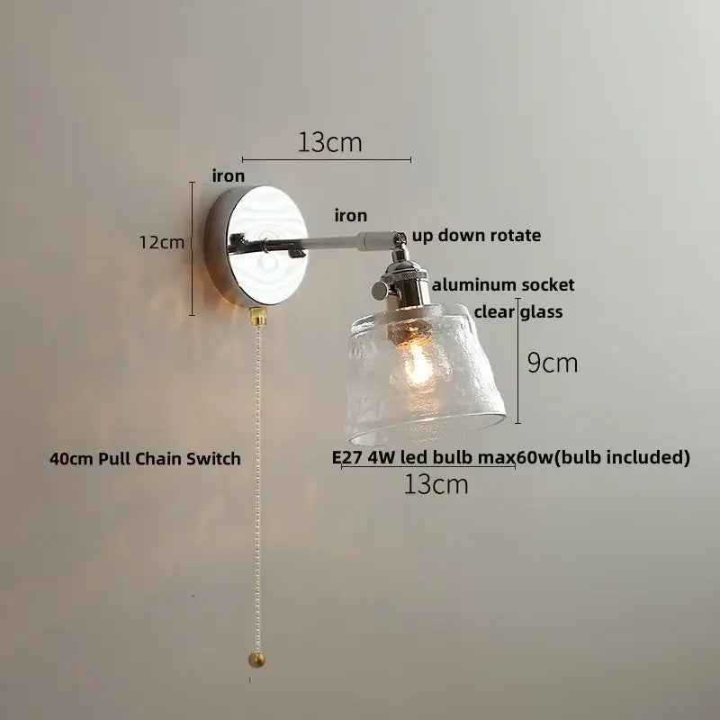 Modern clear glass led wall lamp with polished iron base and adjustable arm featuring decorbites clear glass shade