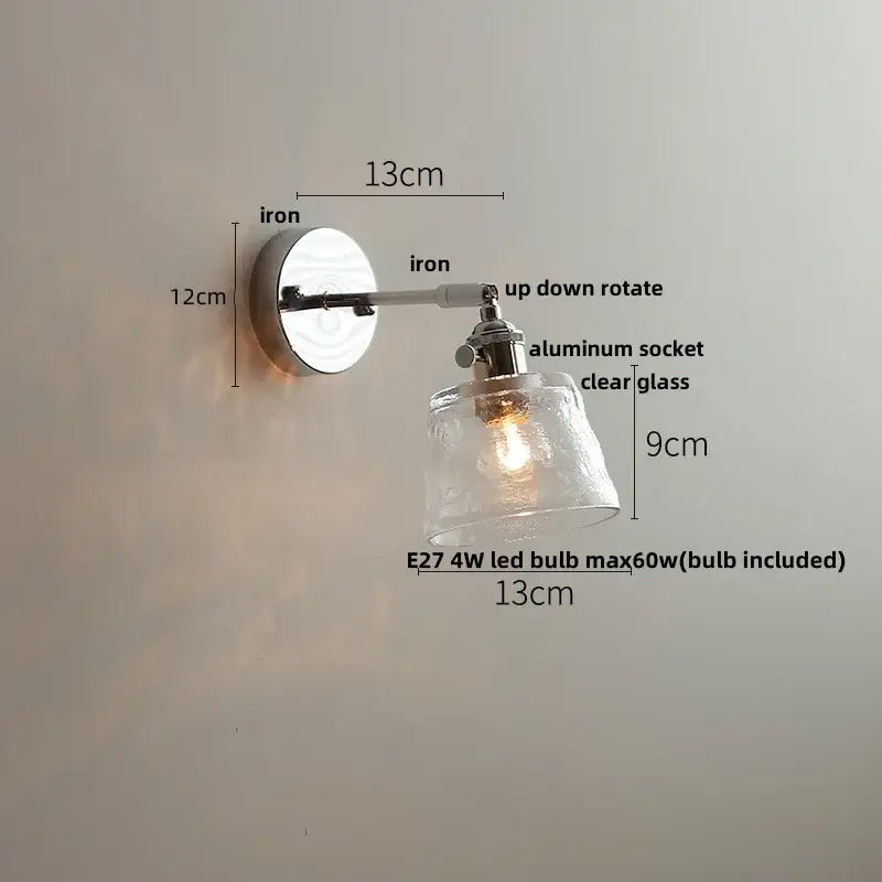 Modern clear glass led wall lamp with polished iron base and adjustable arm for bedroom decorbites clear glass lighting