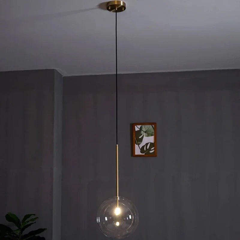 Modern Clear Glass Pendant Light With Gold Finish - Decorbites