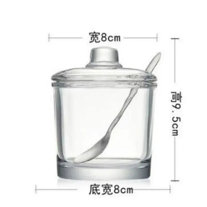 Modern clear glass seasoning spice jar with matching lid and integrated spoon measuring 8cm width and 9.5cm height