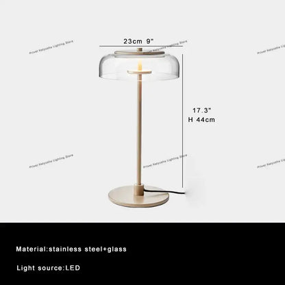 Modern clear glass table lamp with slender stainless steel base and LED light source for bedroom decorbites clear glass