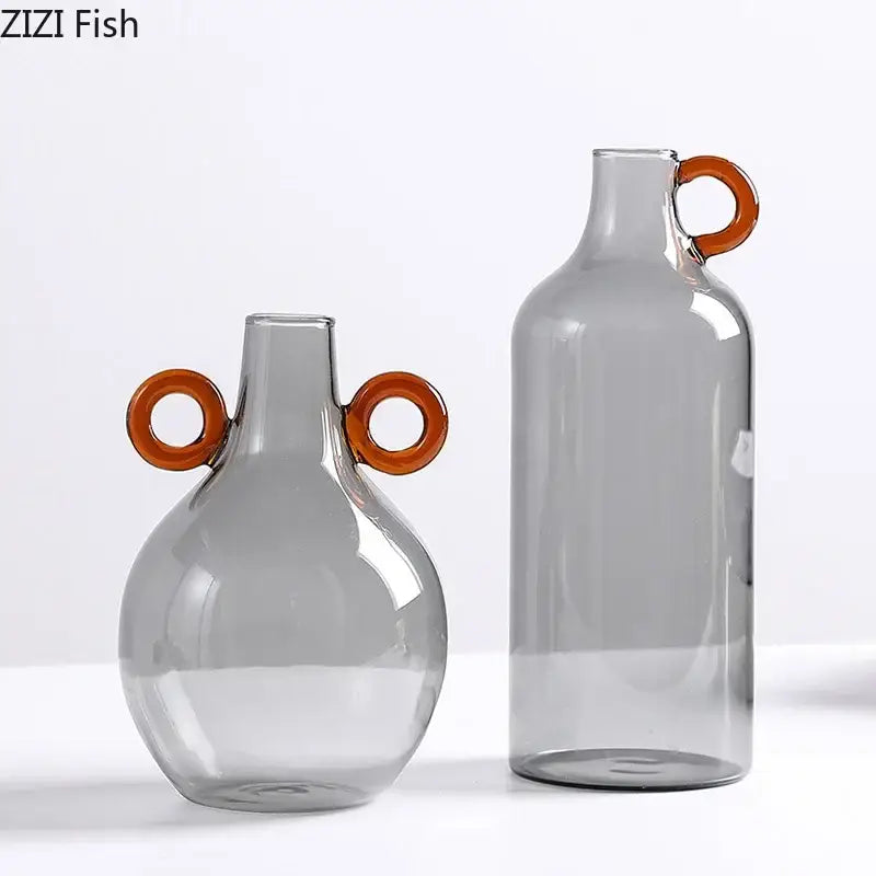 Modern clear glass vase set with amber circular handles featuring rounded and tall designs for decorbites clear glass decor