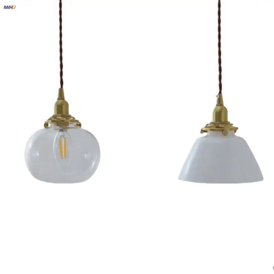 Two vintage-style led pendant lamps with clear glass and white ceramic globes, brass fixtures, and twisted brown cords