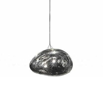 A sleek dark gray glass staircase pendant light with smooth organic shape and swirling internal patterns for dining room