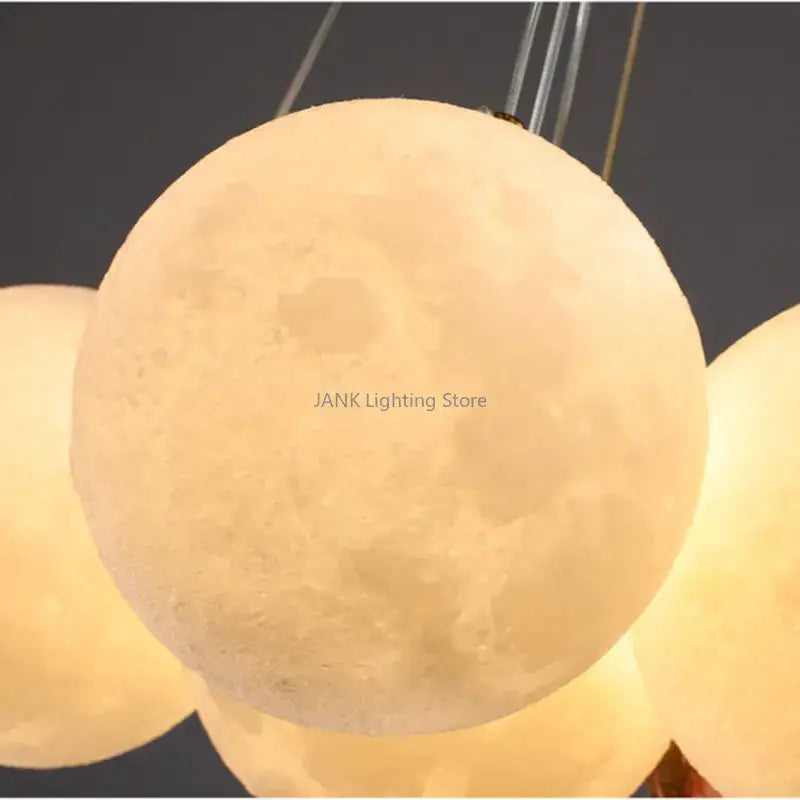 Modern cloud bubble ball pendant chandelier for children room with warm glowing textured moon crater surface decorbites bubble ball