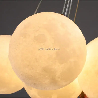 Modern cloud bubble ball pendant chandelier for children room with warm glowing textured moon crater surface decorbites bubble ball