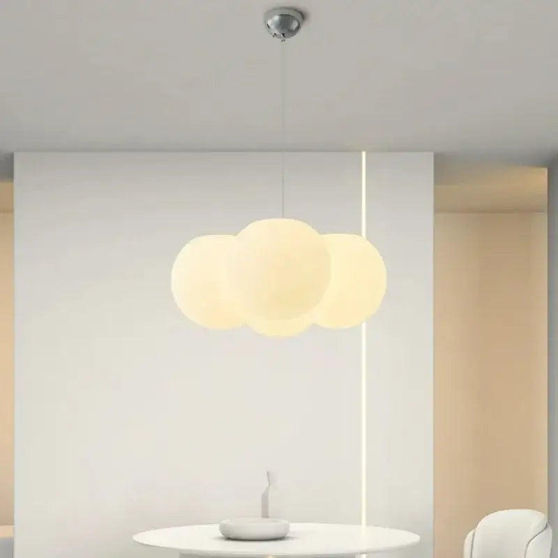 A modern cloud glass ball milky white pendant light with three off-white glass ball milky bulbs for living room decorbites