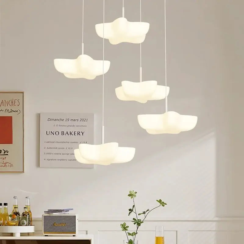Modern cloud white floating pendant light with smooth matte finish hanging from ceiling for dining room decorbites cloud white
