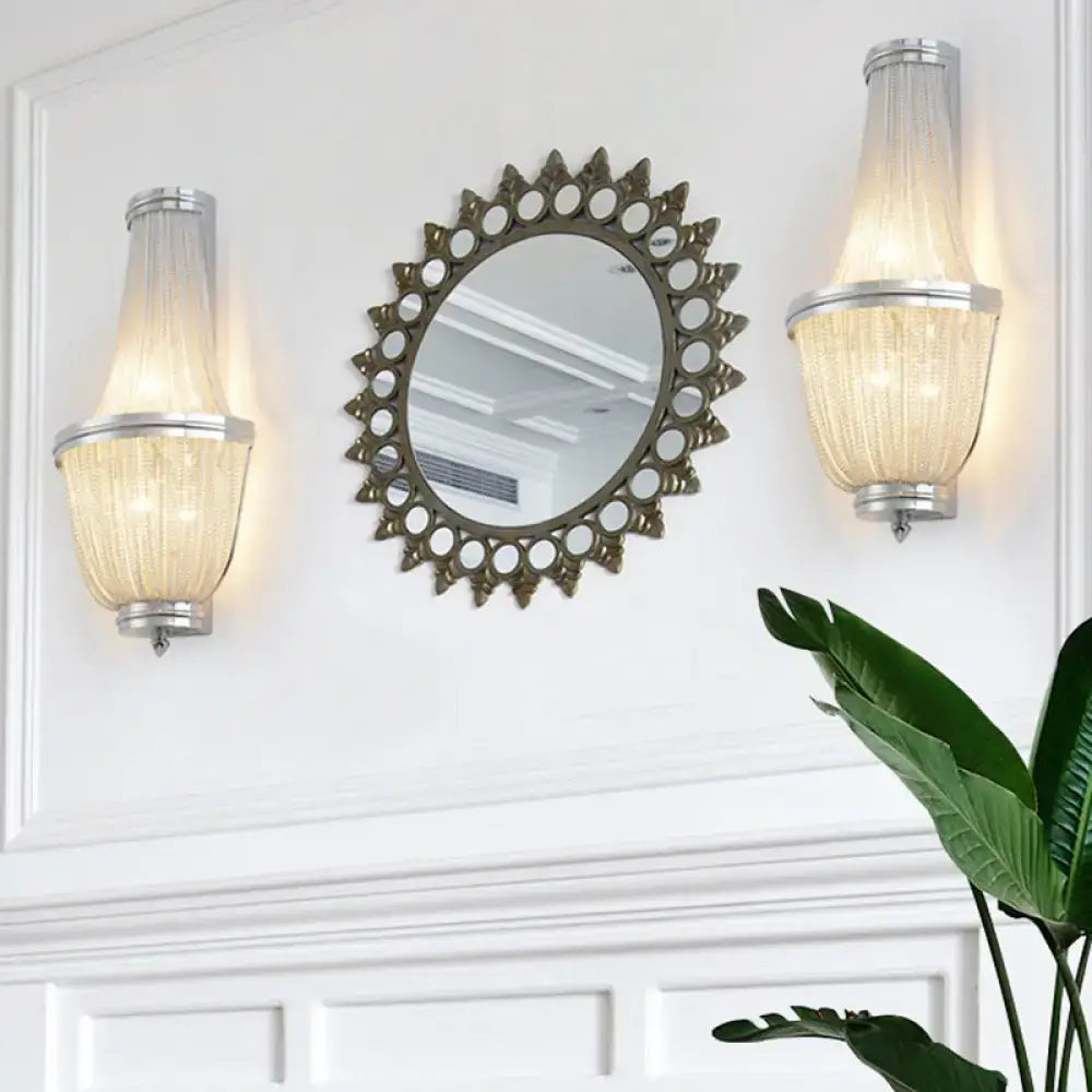 Antique bronze sunburst mirror with intricate cut-out detailing paired with modern coffee silver wall lamp 110v-120v 220v-240v