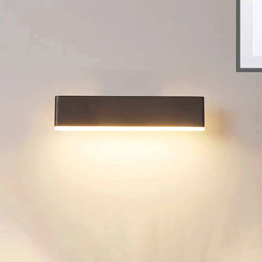 Modern coffee white rectangular sconce with matte black finish emitting warm ambient light and maximum bulb wattage for bedroom use