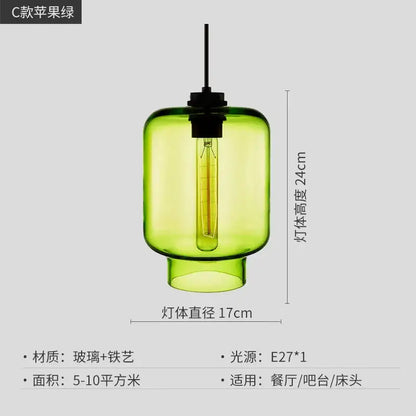 A vibrant green decorbites geometric glass pendant light with black metal fixture and edison bulb for kitchen lighting