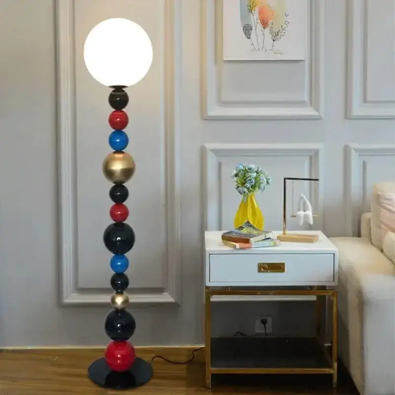 Modern floor lamp with colorful glass ball bulbs in red blue black and gold for living room decor
