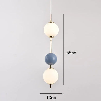 Modern colorful glass ball led pendant light with frosted white and matte blue spheres connected by brass rods for dining room decorbites glass ball pendant light
