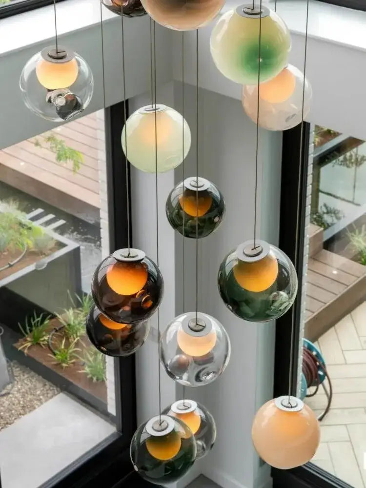 Modern colorful glass ball pendant light with amber green and clear spherical glass globes for dining room decorbites pendant light