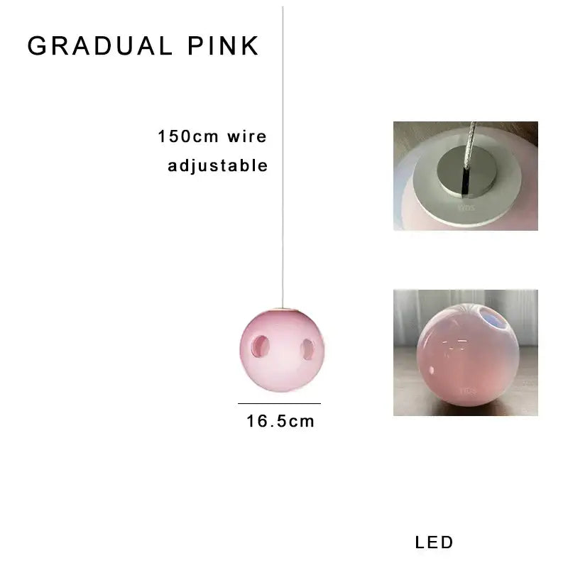 A sleek 16.5cm decorbites glass ball pendant light with pink gradient finish and adjustable led wire suspension for dining room