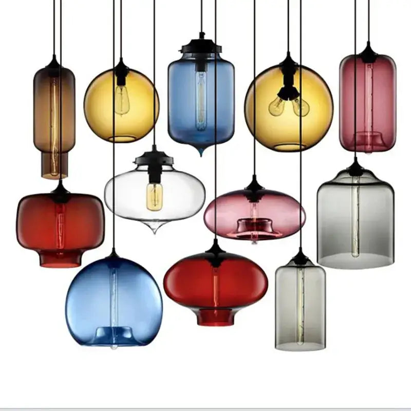 A collection of colorful translucent decorbites glass bowl pendant lights with exposed filament bulbs for kitchen decor