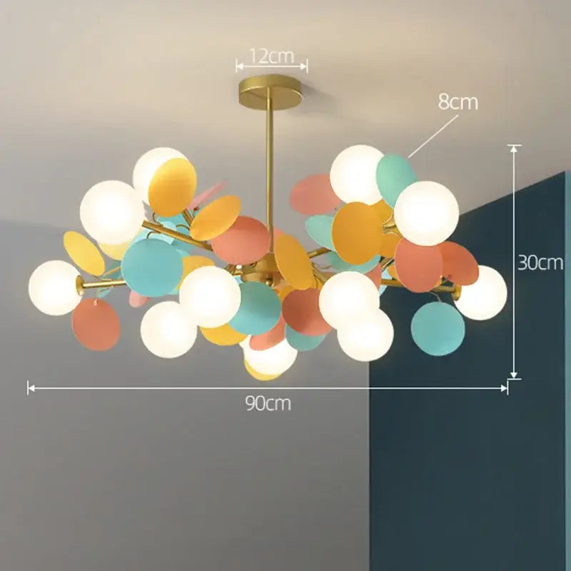 A modern decorbites branch chandelier with brass finish and colorful glass orbs for living room decor