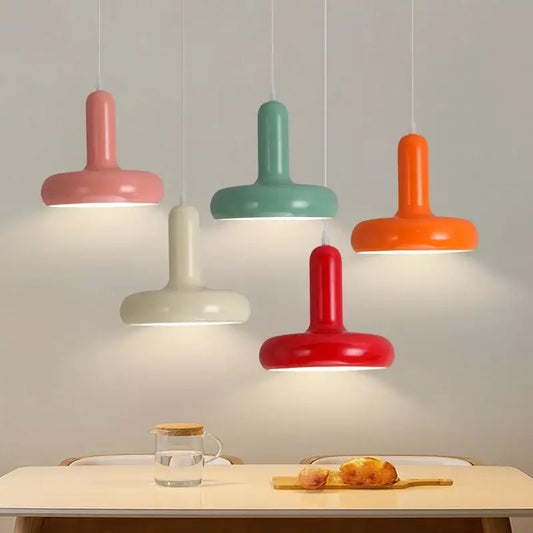 Five colorful modern pendant lights with smooth painted aluminum finish in pastel pink, mint, cream, orange, and red