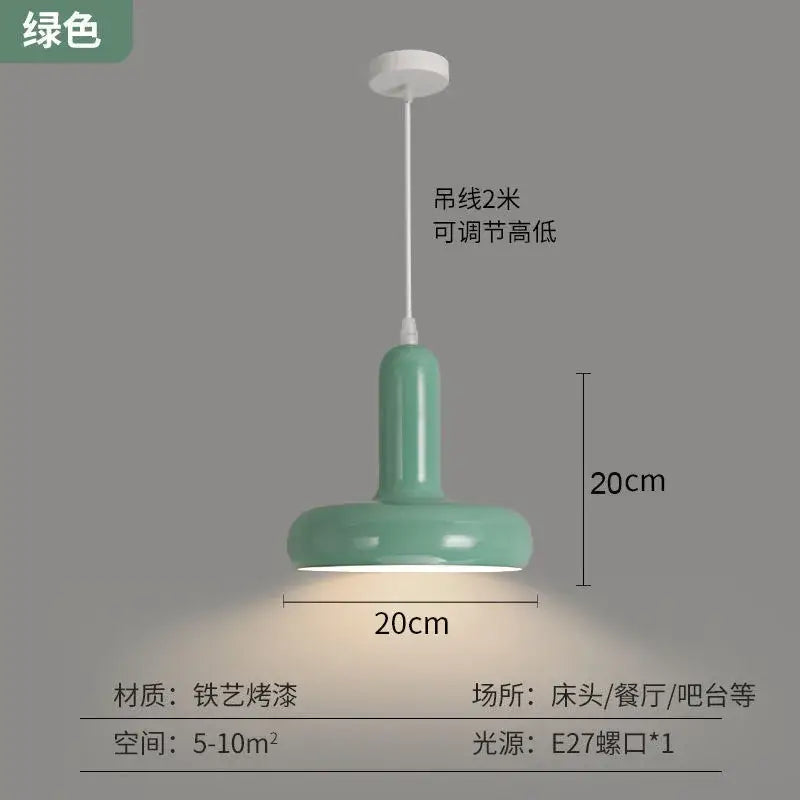 A mint green glossy painted aluminum pendant light with cylindrical body and wide base for kitchen and dining room