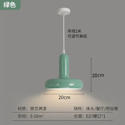 A mint green glossy painted aluminum pendant light with cylindrical body and wide base for kitchen and dining room