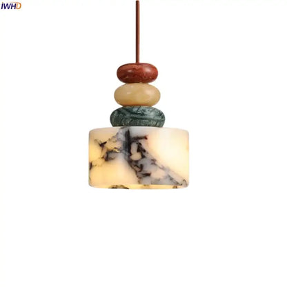 A modern pendant lamp with stacked polished colorful stone led in red beige green and cream for dining room decorbites decor