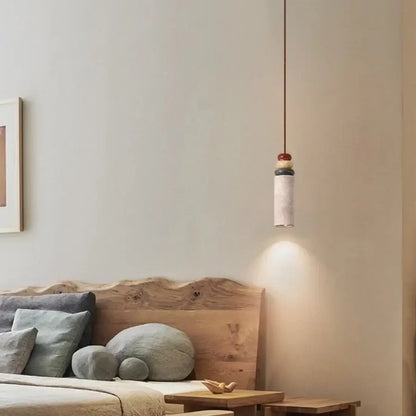 Modern colorful stone led pendant light with a cylindrical concrete body and stacked colorful beads for dining room decorbites colorful stone design