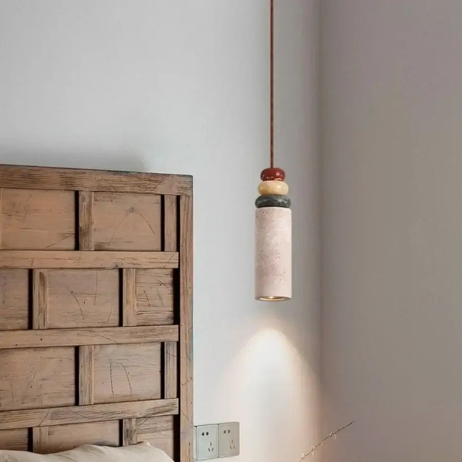 Modern colorful stone led pendant light with textured off-white ceramic body and red yellow dark gray stone accents