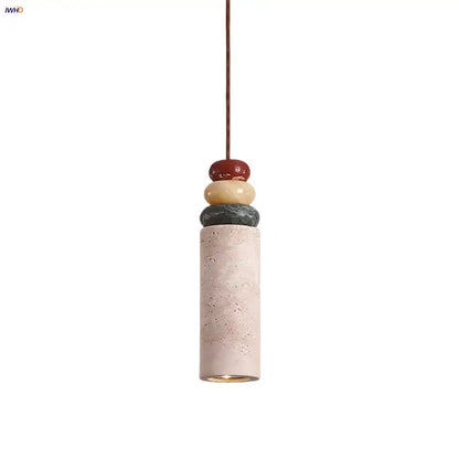Modern pendant light with a beige concrete cylinder topped by colorful stone led in red yellowish beige and dark gray for dining room decorbites colorful stone